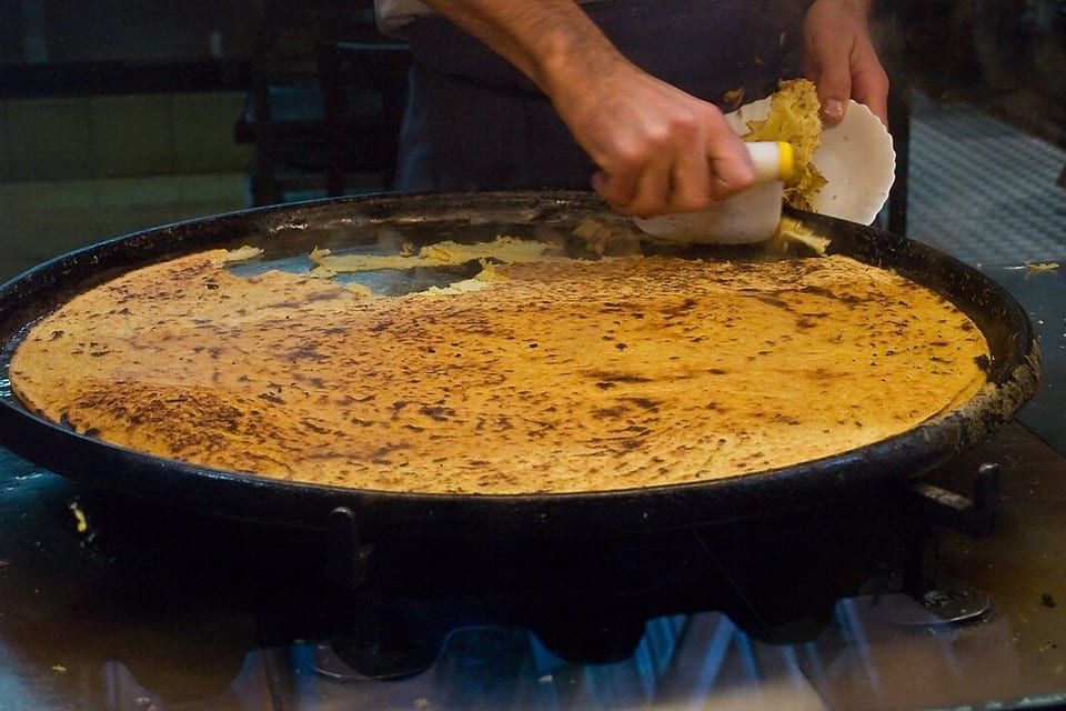 Freshly baked wood-fired socca, the speciality of Chez Théresa on Cours Saleya
