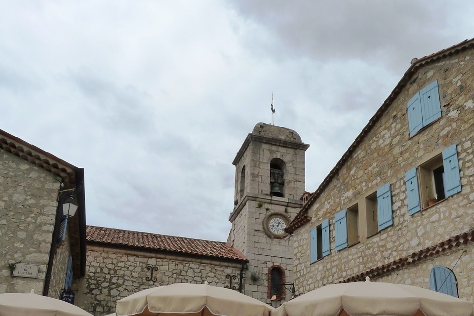 Bell tower of the Église Saint-Vincent on the church square in Gourdon
